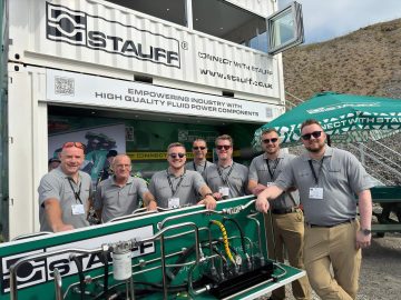 Multi-tier custom shipping container conversion build exhibition stand for Stauff with fitted bi-fold windows, staircase and electrics at Hillhead.