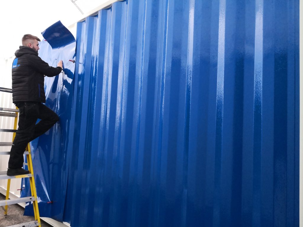 The Container Converter team assessing used shipping container ahead of conversion